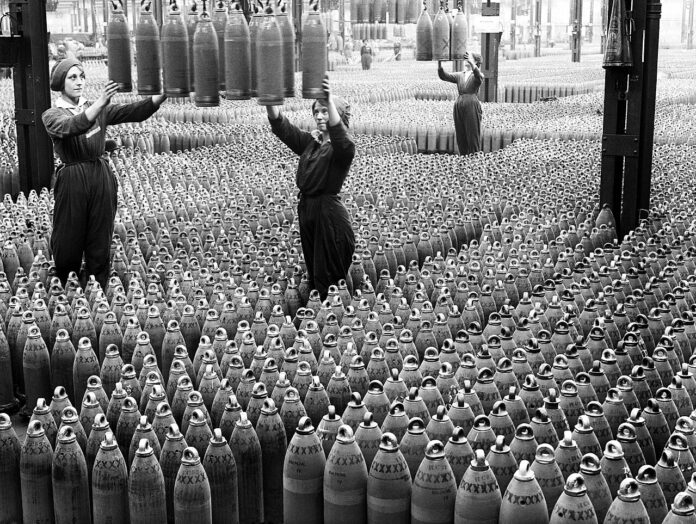1280px-Women_workers_with_shells_in_Chilwell_filling_factory_1917_IWM_Q_30040